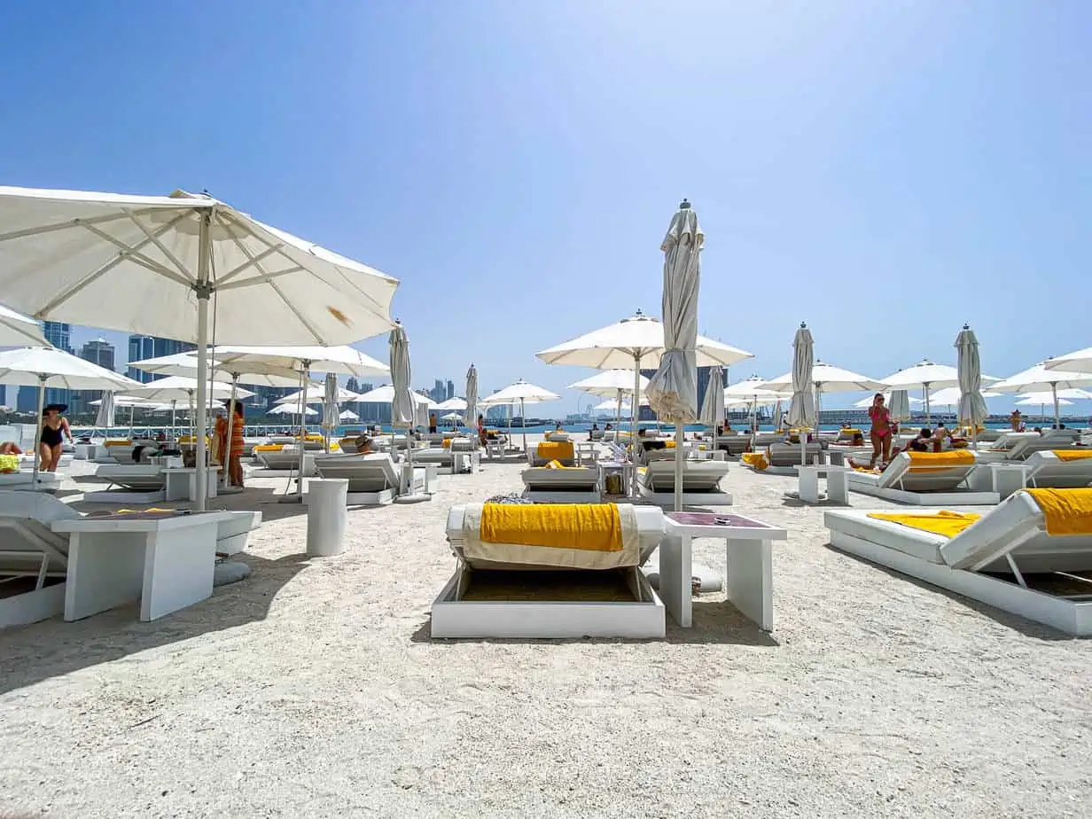 FIVE Palm Jumeirah's beach front looking out onto the Arabia sea and beach beds for guests.