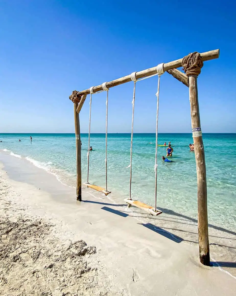 kite beach umm al quwain swings in the sea