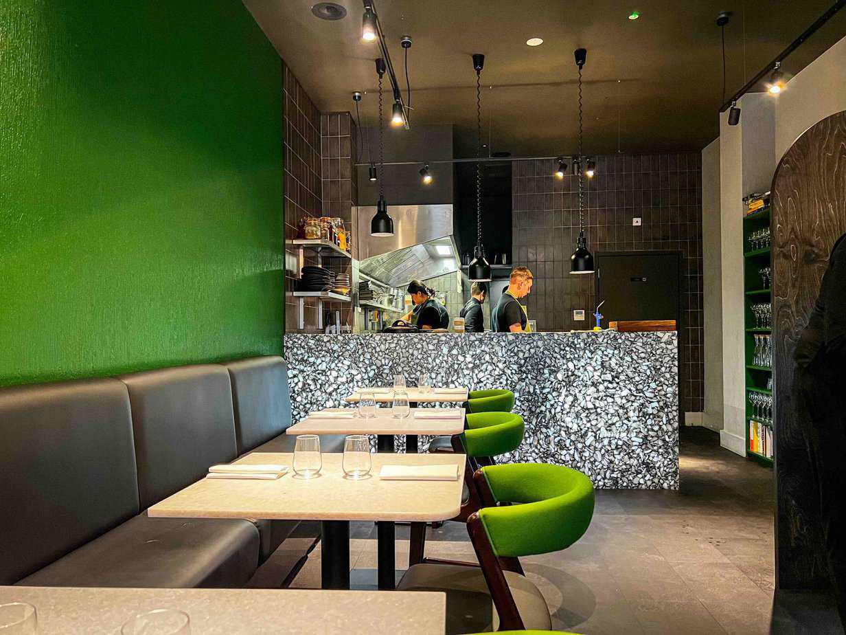 Land Restaurant is a vegan Michelin recommended restaurant in Birmingham's Great Western Arcade. This is the inside of the restaurant looking towards the open plan kitchen.