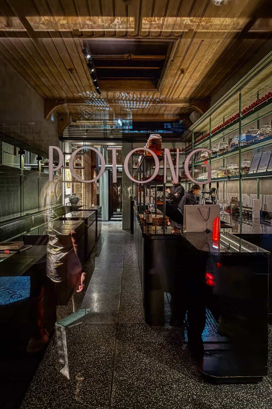 Potong's front door opening is branded with its logo. Potong is Michelin starred restaurant in Bangkok's Chinatown helmed by Chef Pam.