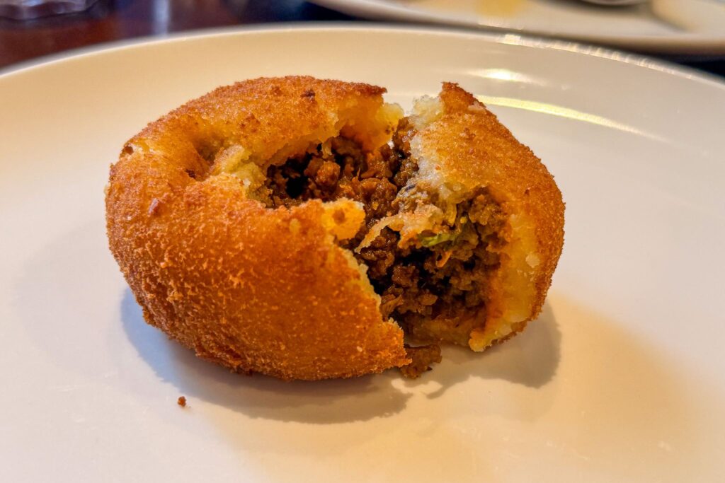 Fried mutton potato chop filled with spiced minced meat at Eric’s Restaurant in Dubai