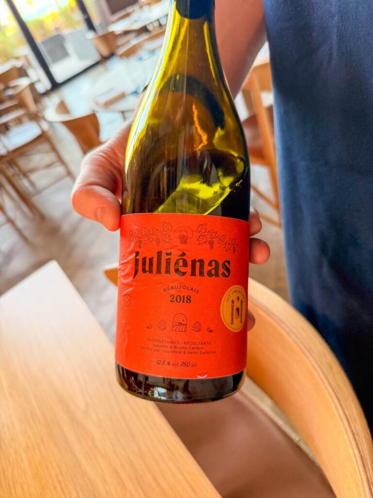 A bottle of Juliénas 2018 Beaujolais by Isabelle and Bruno Gardon, presented at the table at Blue restaurant, Abu Dhabi