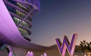 W Abu Dhabi - Yas Island's fountains at the entrance of the hotel with the W logo tinted in purple.